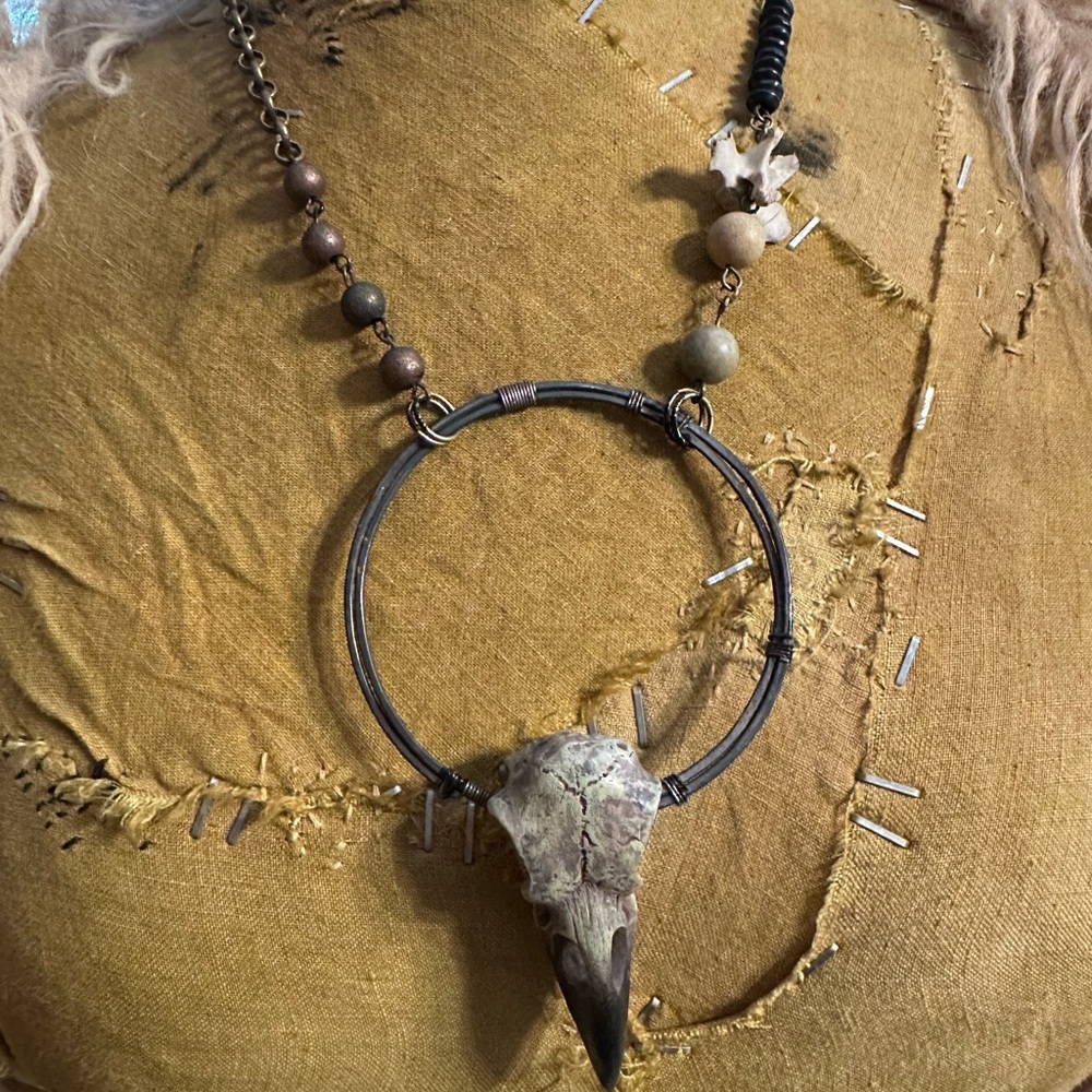 pieced raven skull necklace